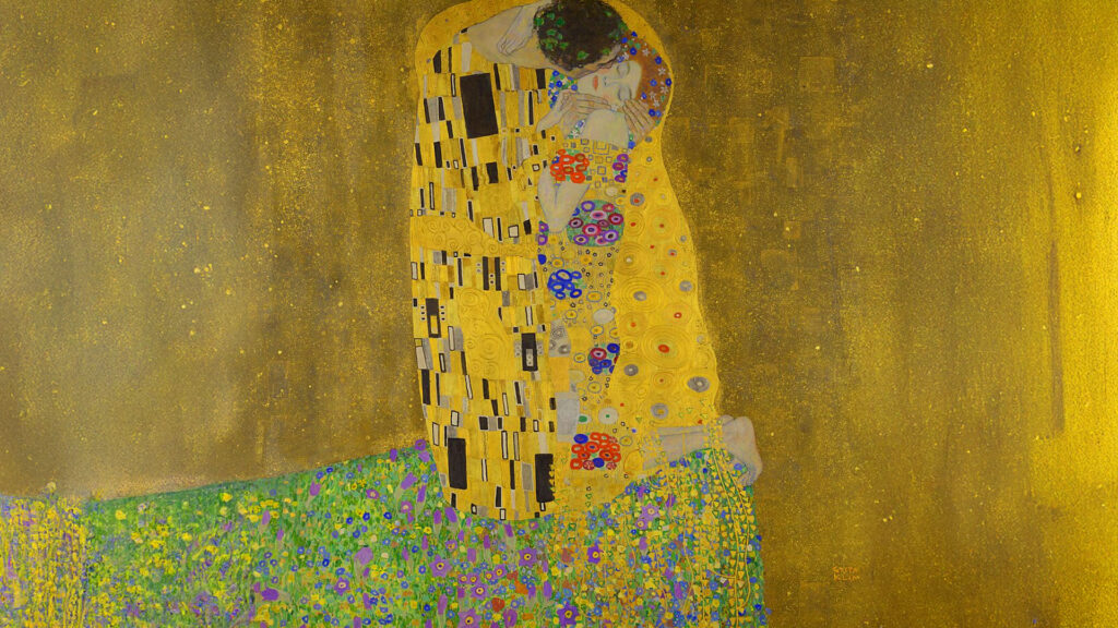 Słynny obraz Gustava Klimta "Pocałunek" przedstawiający parę w objęciach na złotym tle.
